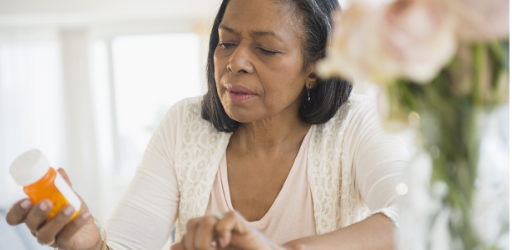 A patient reading LIVALO® dosing information